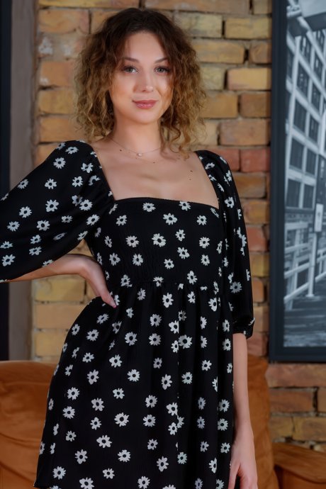 Isabela De Laa playfully lifts her dress, showcasing her naked curvaceous figure